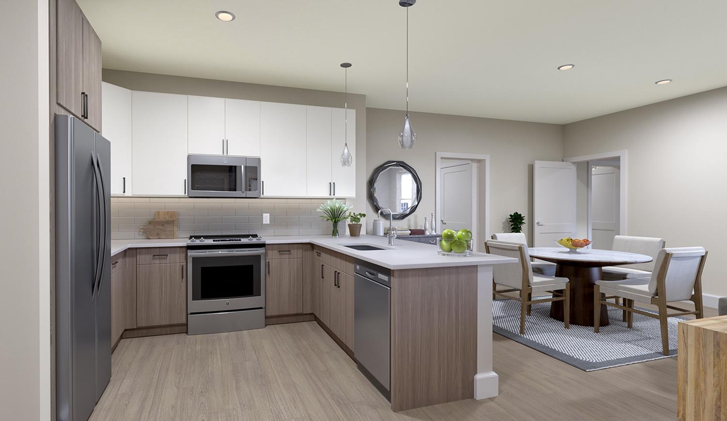 Atlee Square luxury apartment kitchen & dining room at Langhorne, PA, with modern appliances, table, chairs, & ample counter space.